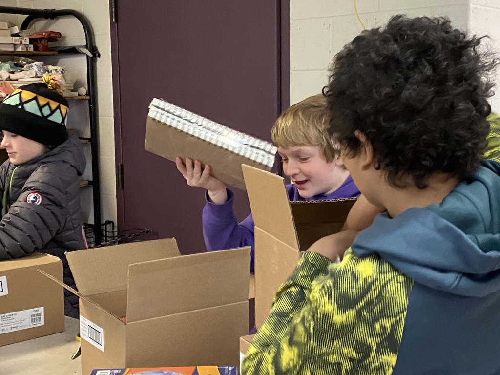 GSB students opening new Prang art supplies