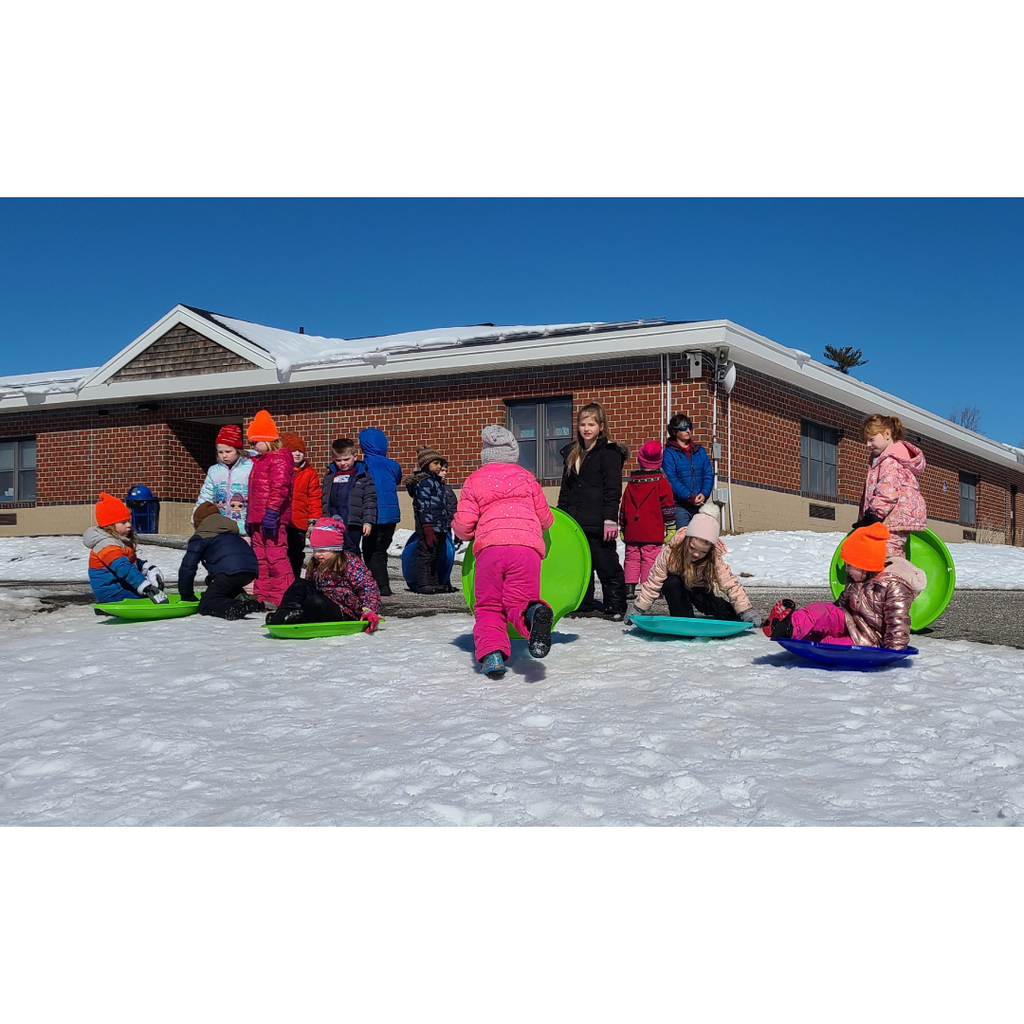 Kindergarteners sledding at recess